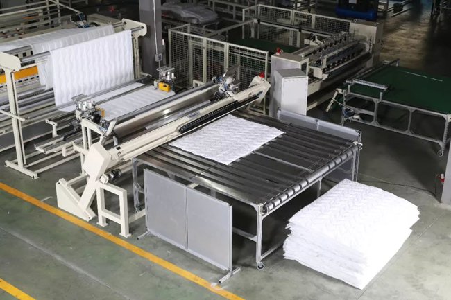 Computerized 
multi-needle rotary hook quilting machine + Automatic four-sided overlock sewing 
machine